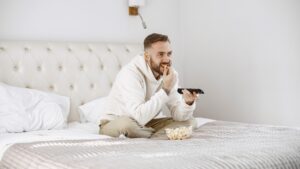 man watching casting in hotels