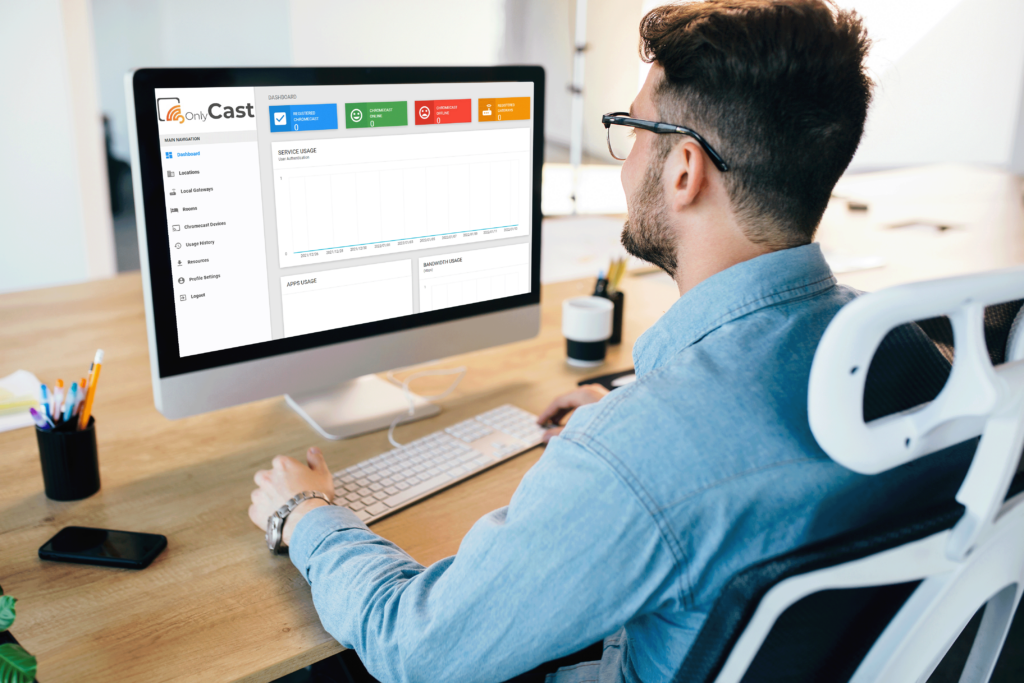 man on computer monitoring hotel cast solutions