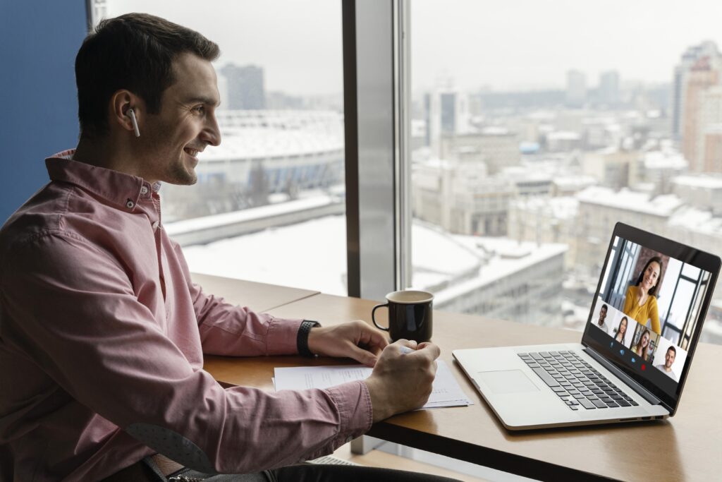 man in virtual meeting about hotel cast solution