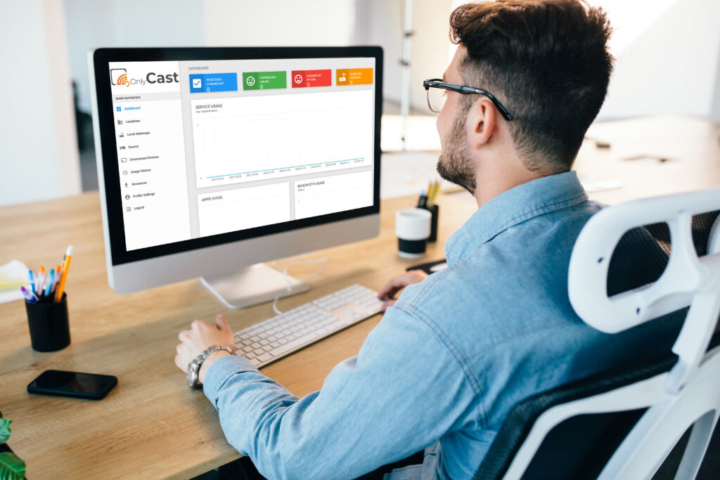 man on computer monitoring hotel cast solution