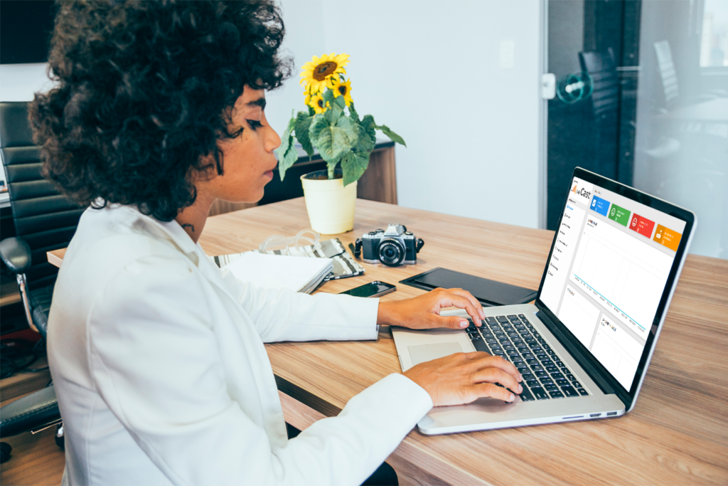 business womanusing laptop to monitor chromecast for hospitality solution